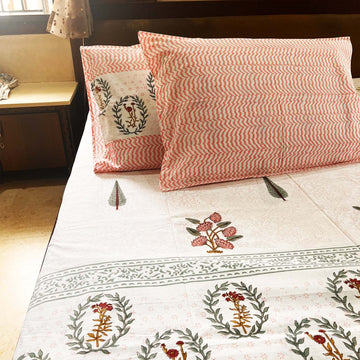 Orange Floral Block Printed Cotton Double Bedsheet Set With 2 Pillow Covers - 108 inches x 108 inches