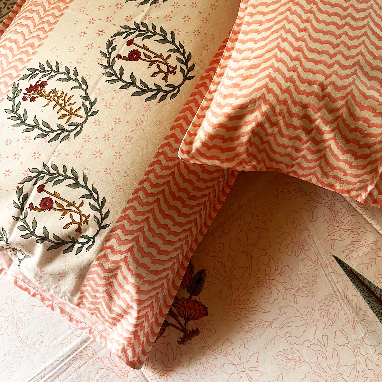 Orange Floral Block Printed Cotton Double Bedsheet Set With 2 Pillow Covers - 108 inches x 108 inches