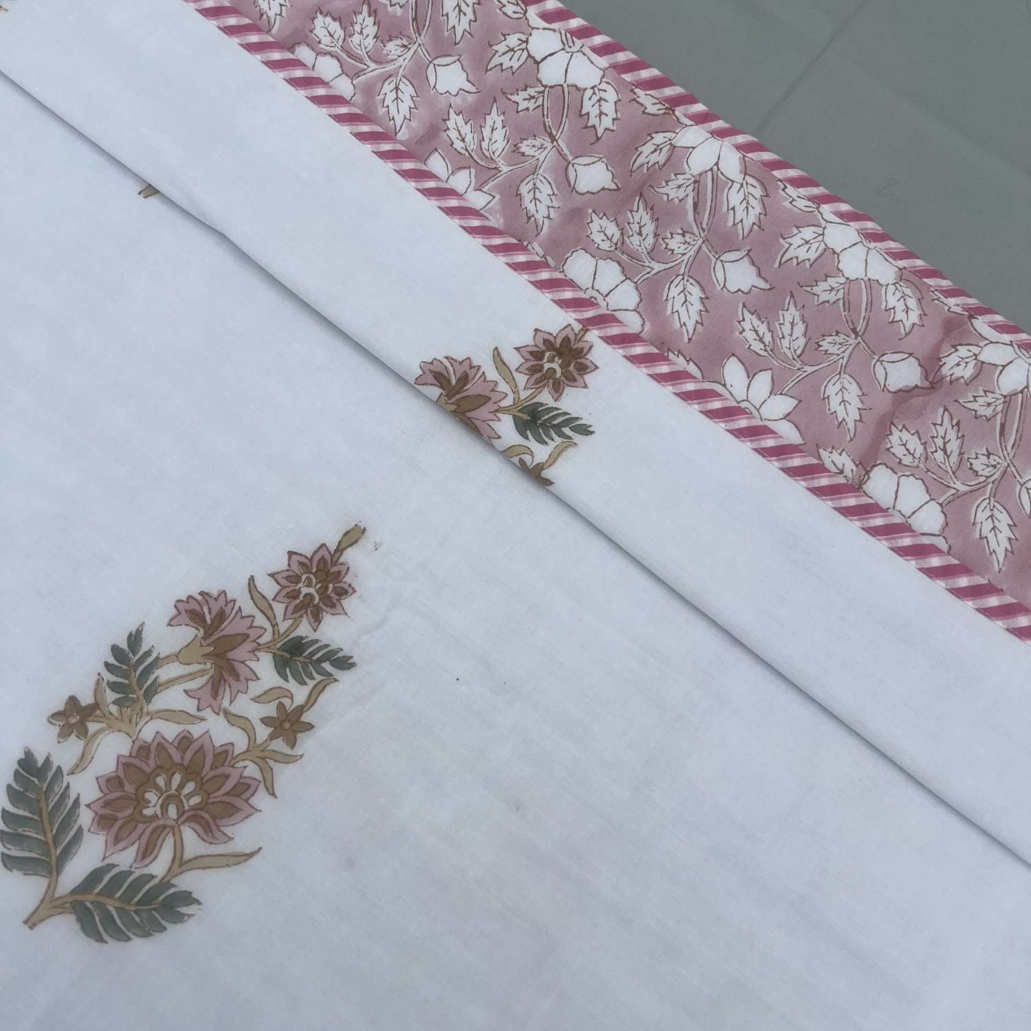 Embroidered fabric with floral patterns on a white background