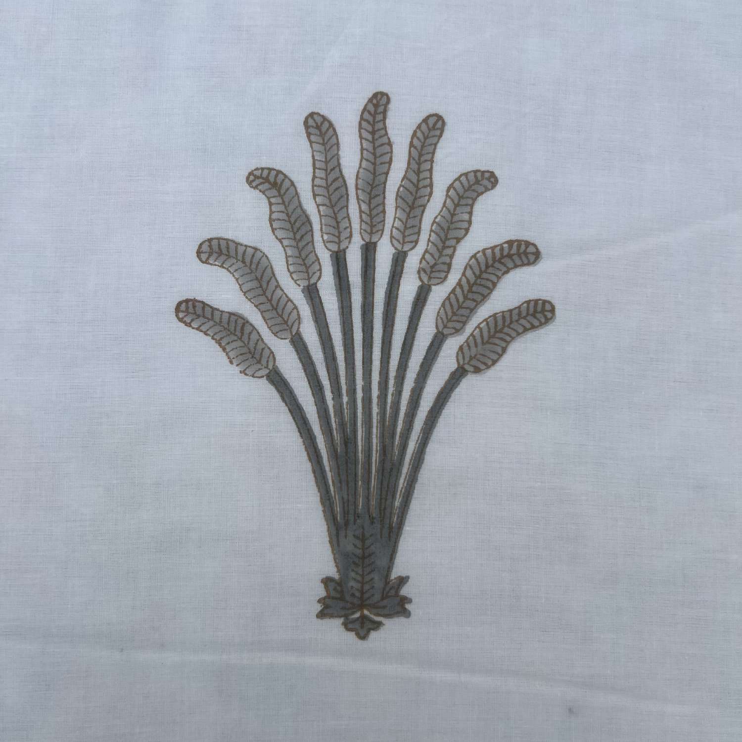 Decorative leaf pattern on a white fabric background
