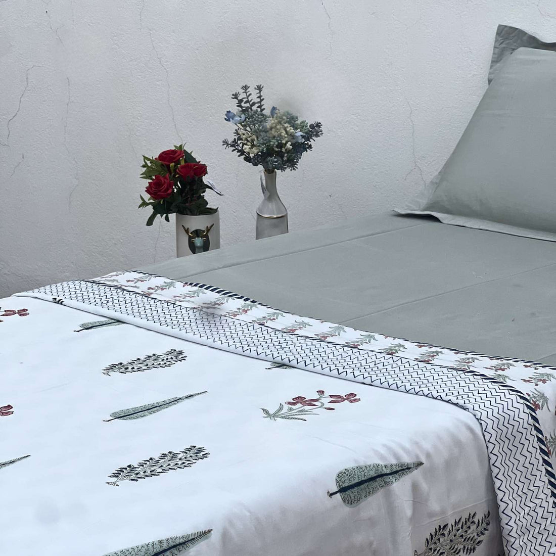 Fabric with zigzag pattern and floral designs on a white background