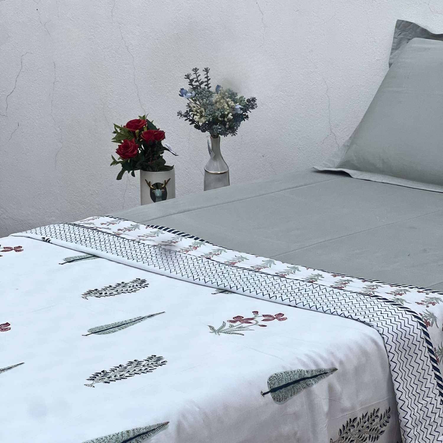 Fabric with zigzag pattern and floral designs on a white background