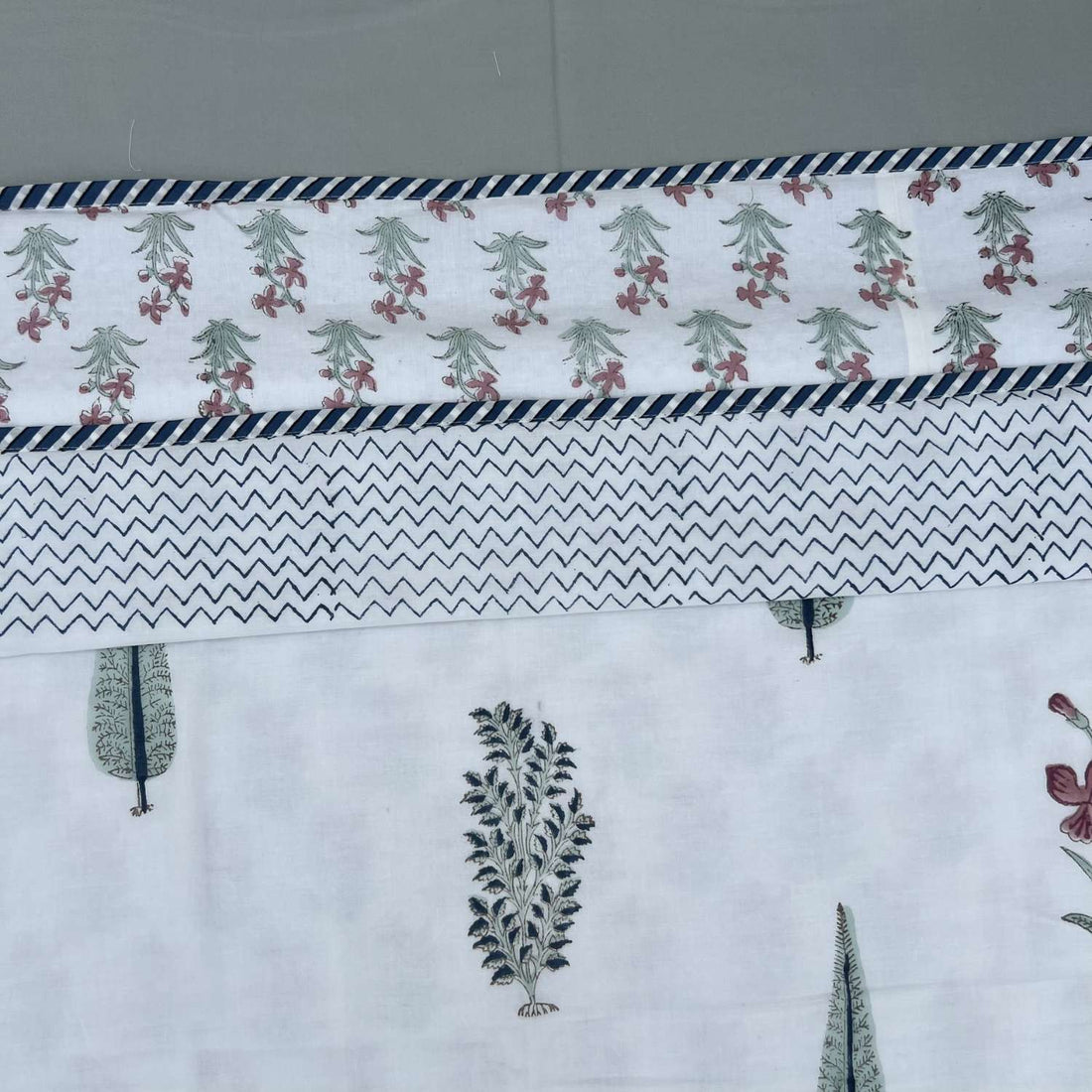Fabric with zigzag pattern and floral designs on a white background
